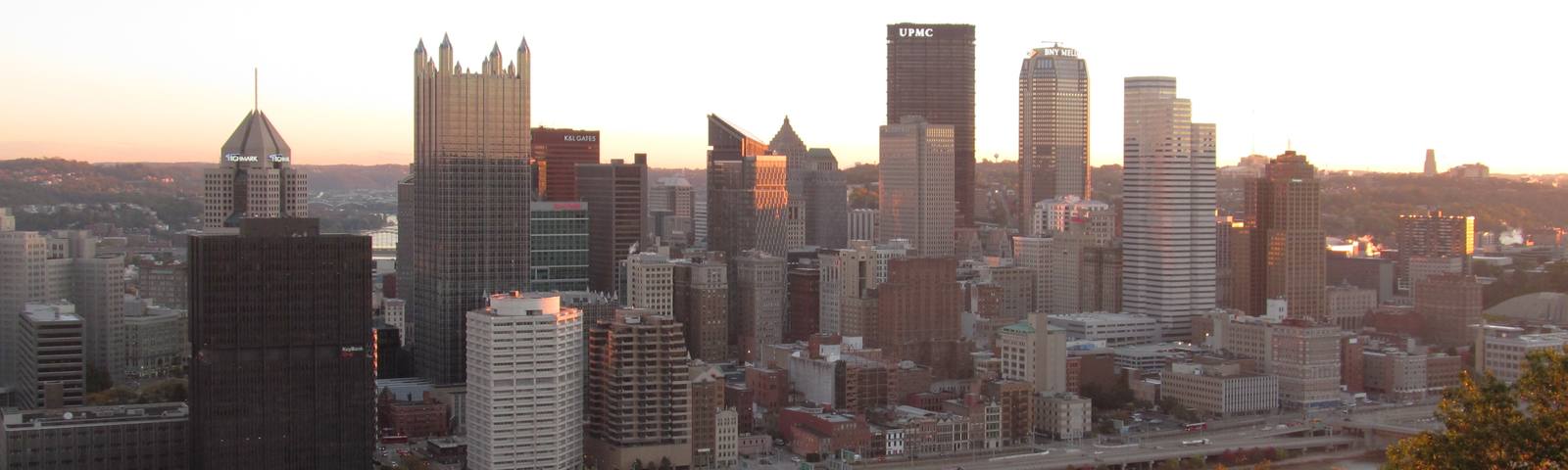 Downtown Pittsburgh skyline at sunrise across the river